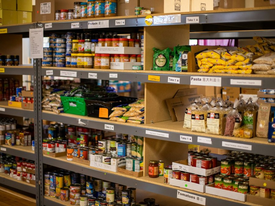 Shelves of canned and dry goods at a community food pantry.